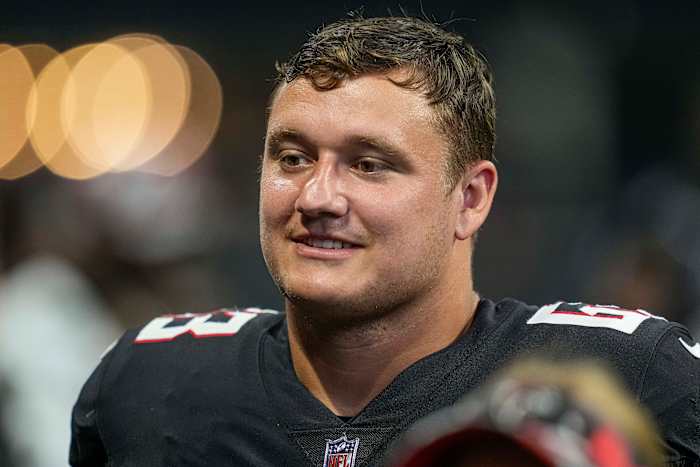 Aug 27, 2022; Atlanta, Georgia, USA; Atlanta Falcons guard Chris Lindstrom (63) on the bench against the Jacksonville Jaguars during the second half at Mercedes-Benz Stadium.